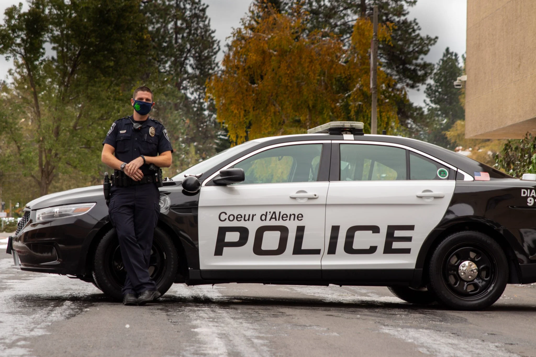Officer Gus Wessel poses next to his police car at North Idaho College. Photo Credit: NIC Sentinel