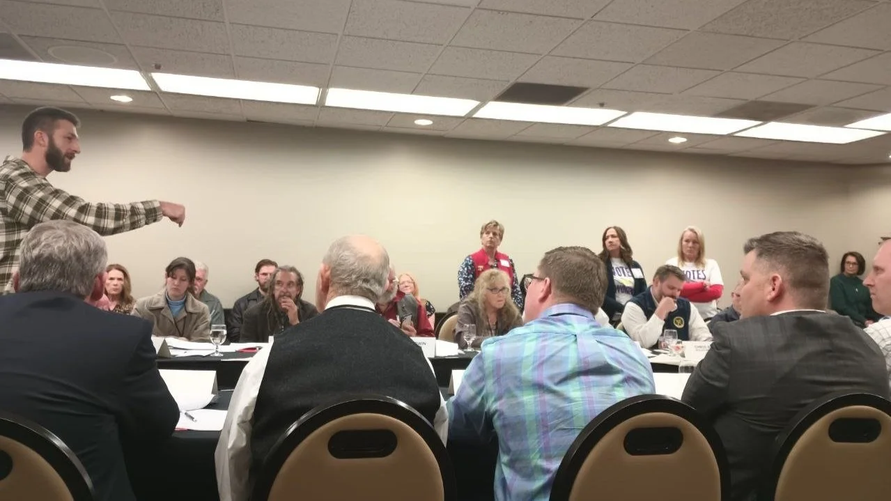  Dan Bell (left) arguing in favor of rule change. 