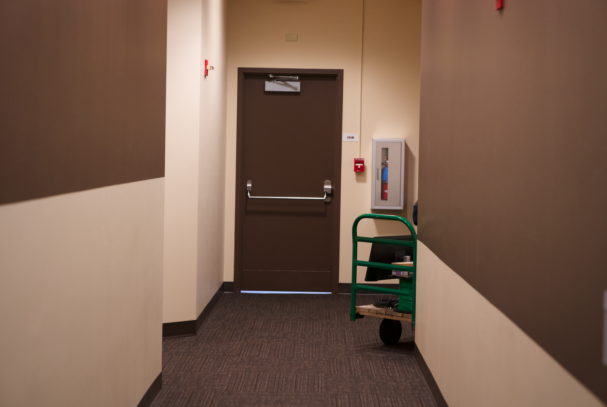 Corridor 201B leads from the main entrance of the Board Meeting Room on the second floor of the Student Union Building, as referenced in the NIC Security report and Officer Wessel’s testimony. The fire alarm is right next to the door to the stairwell that leads to the back door exit of the building.